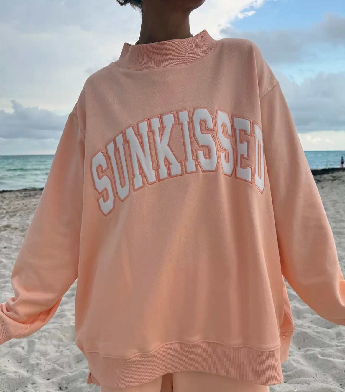 Sun-kissed mock neck